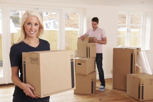Local man and van unloading boxes and furniture at a Haringey property