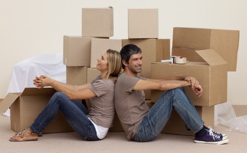 Careful moving team handling boxes and furniture in Haringey