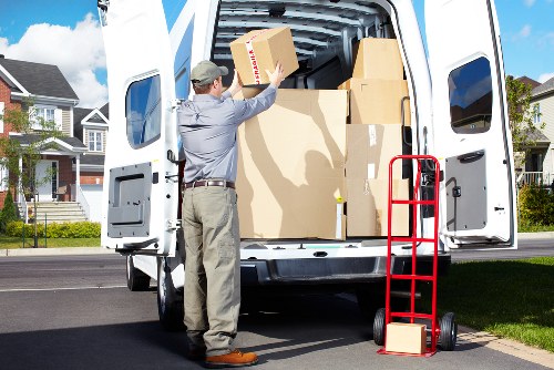 Packed moving boxes and furniture ready for transport